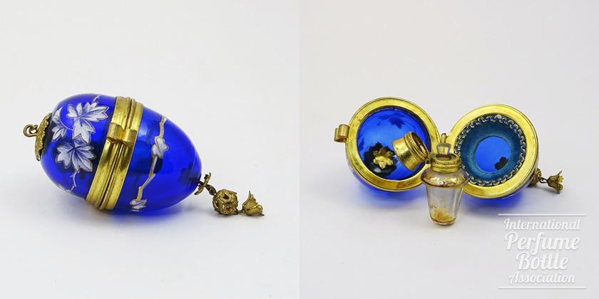 Blue Glass Egg Holding Perfume Bottle